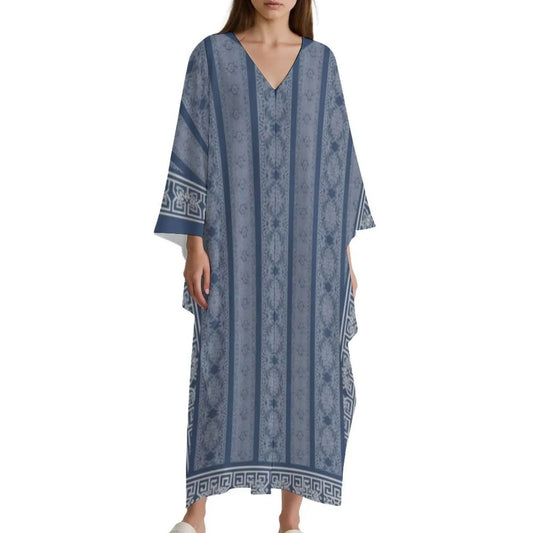 Woman wearing blue patterned V-neck long kaftan dress with wide sleeves and geometric border