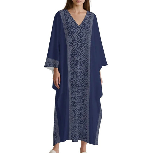 Woman wearing navy blue V-neck kaftan dress with decorative vertical grey patterns and wide sleeves