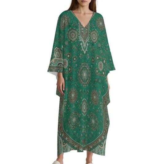 Woman wearing green V-neck kaftan dress with intricate mandala patterns and wide sleeves