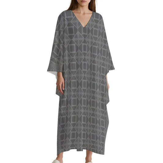Woman wearing gray V-neck kaftan dress with geometric pattern and wide sleeves