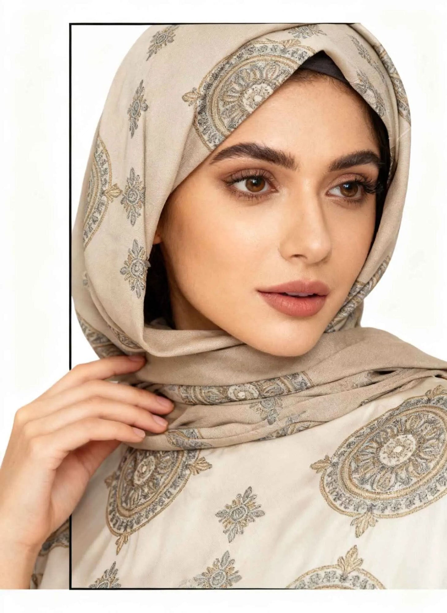 Close-up of woman wearing beige scarf hijab with intricate circular pattern