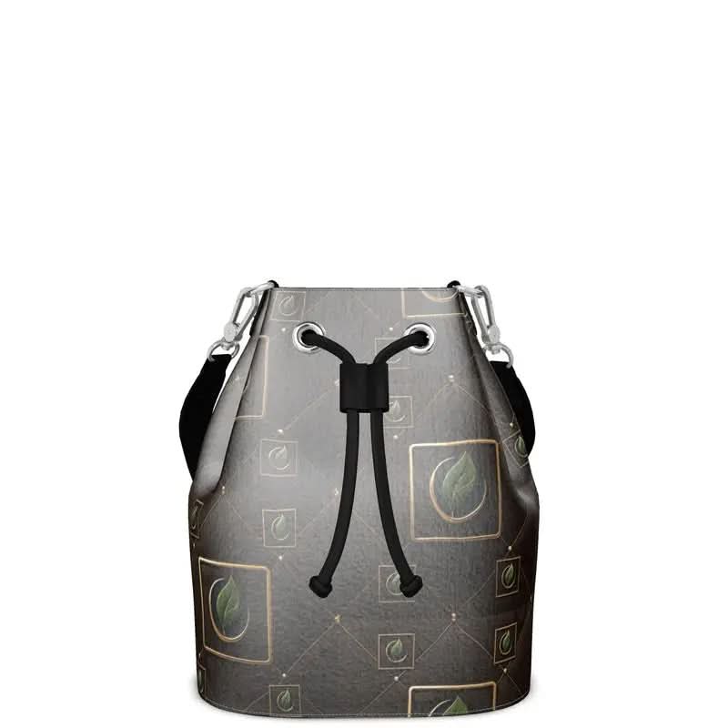 Gray bucket bag with black drawstring and green leaf pattern in square frames