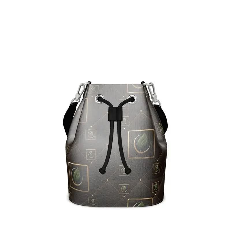 Black bucket bag with green leaf pattern and drawstring closure on white background