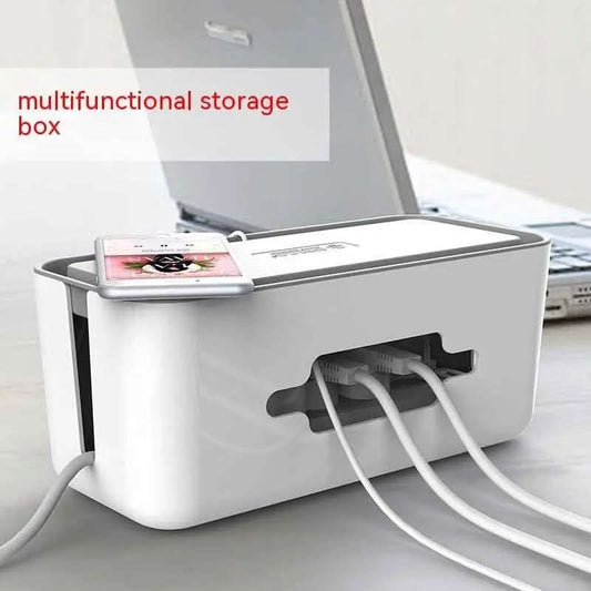 White multifunctional cable storage box organizing multiple Ethernet cables next to a laptop