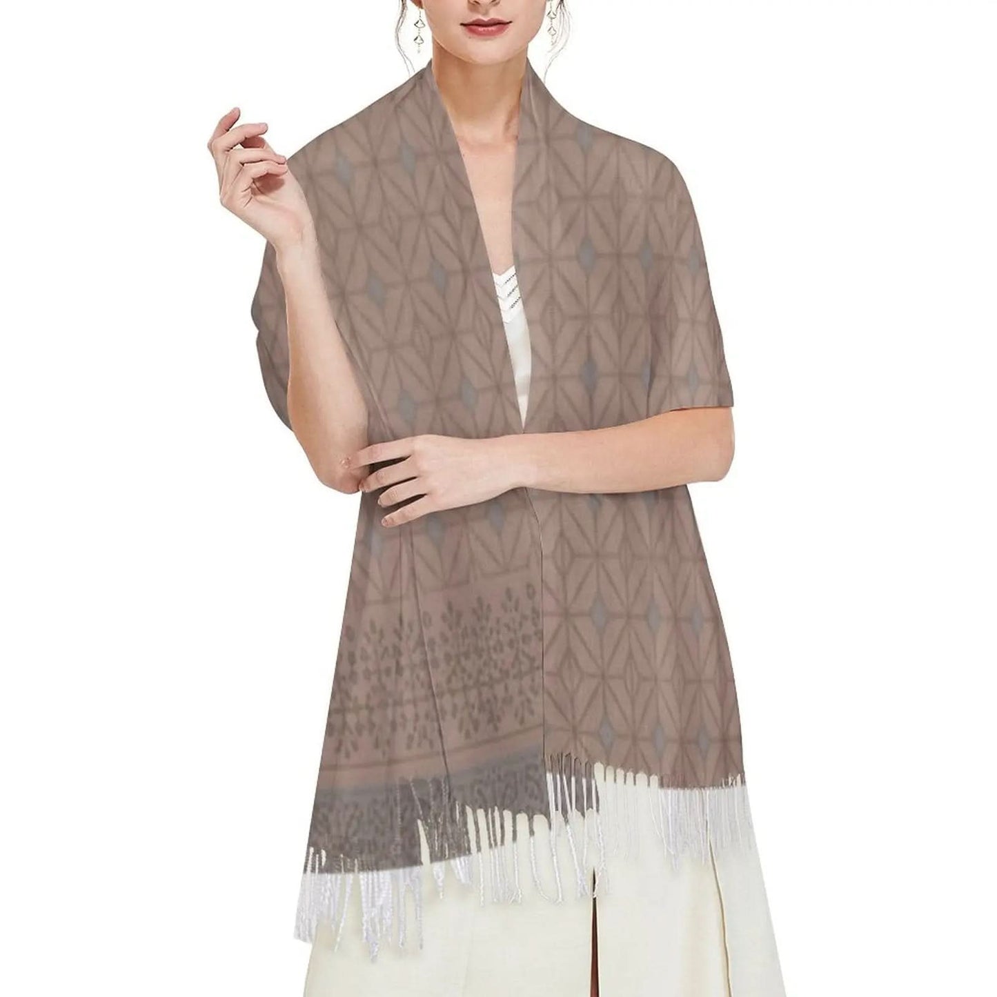 Woman wearing brown geometric patterned tassel scarf over white dress