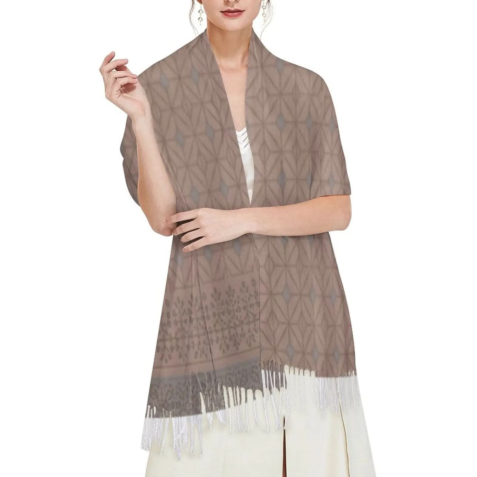 Woman wearing brown geometric patterned tassel scarf over white dress