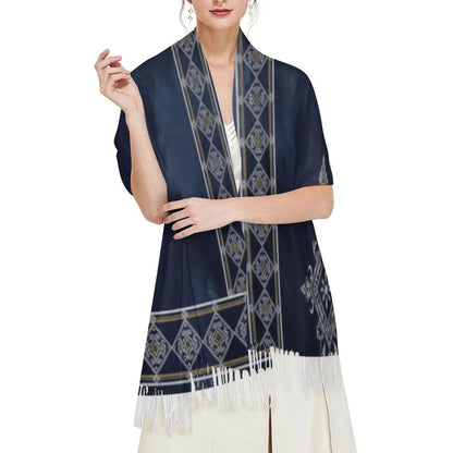 Woman wearing navy blue tassel scarf with geometric diamond pattern over white dress