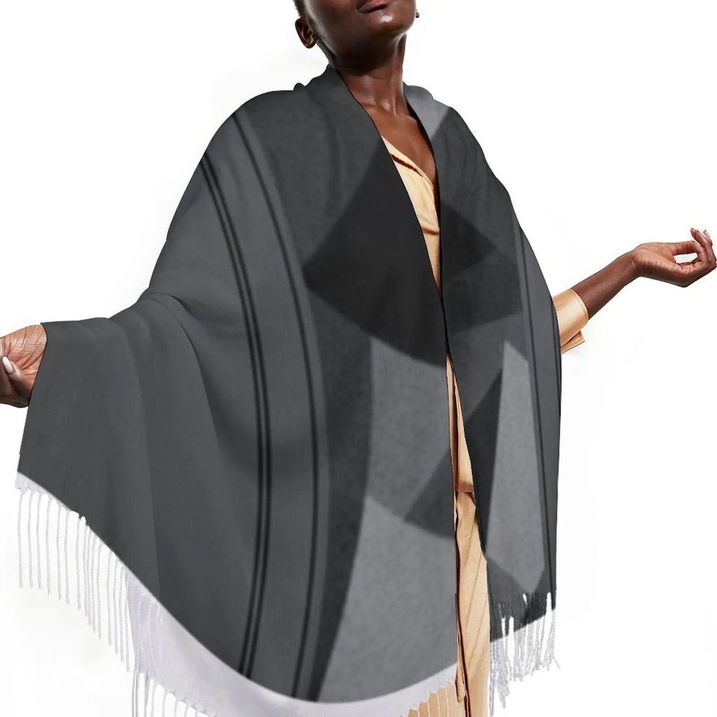 Black and gray geometric design tassel scarf worn by a person with outstretched arms