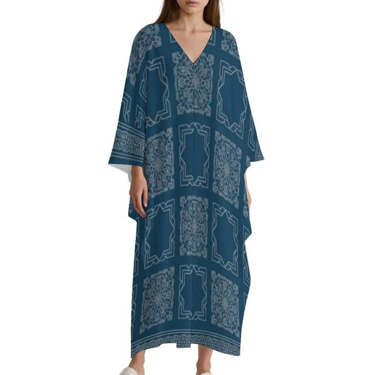 Woman wearing blue V-neck kaftan dress with light geometric and floral patterns