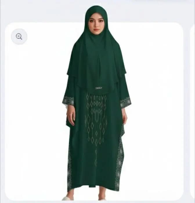 Woman wearing dark green modest kaftan dress with geometric patterns and matching hijab on white background