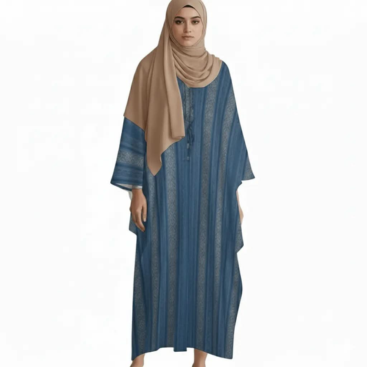 Woman wearing a blue striped kaftan dress with a beige hijab on white background
