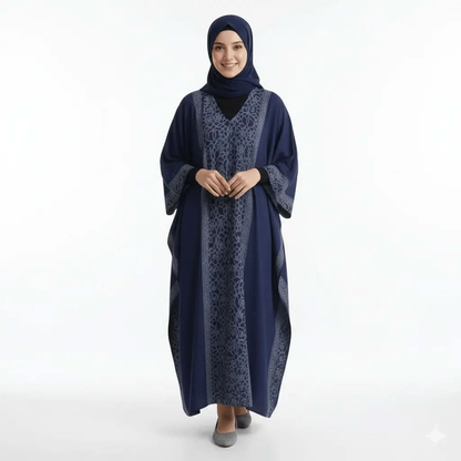 Woman wearing navy blue v-neck kaftan dress with geometric pattern and hijab, standing on white background