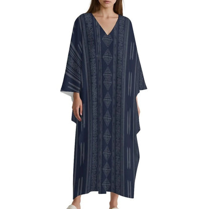 Woman wearing navy blue V-neck kaftan dress with vertical tribal patterns on white background