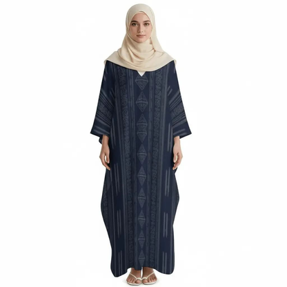 Woman wearing a navy blue v-neck kaftan dress with geometric patterns and a beige hijab