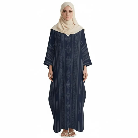 Woman wearing a navy blue v-neck kaftan dress with geometric patterns and a beige hijab