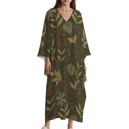 Woman wearing olive green floral print V-neck kaftan dress with wide sleeves and ankle length
