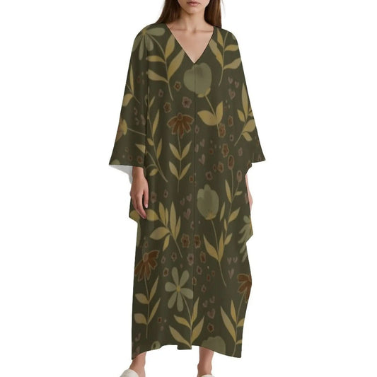 Woman wearing olive green floral print V-neck kaftan dress with wide sleeves and ankle length