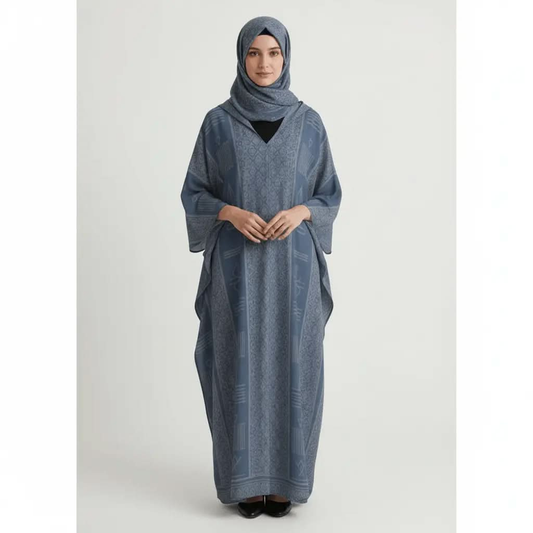 Woman wearing a blue patterned V-neck kaftan dress and matching hijab on a white background