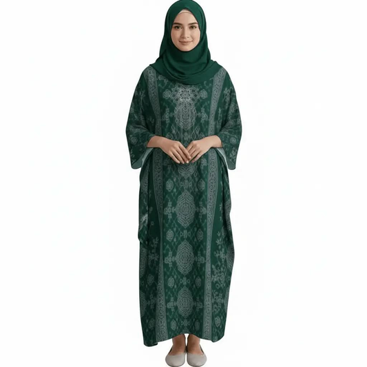 Woman wearing dark green embroidered kaftan dress with full sleeves and matching hijab