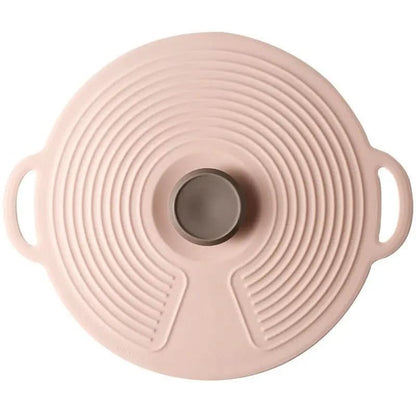 Round pink food-grade silicone lid with handles and concentric circular ridges for sealing