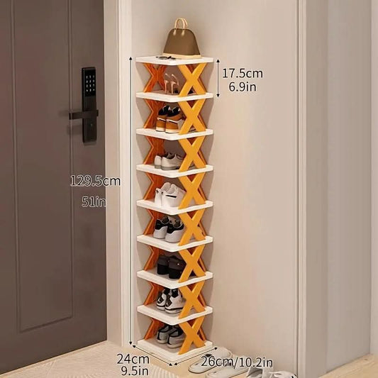 9-layer orange and white shoe rack with cross supports standing in hallway corner with shoes